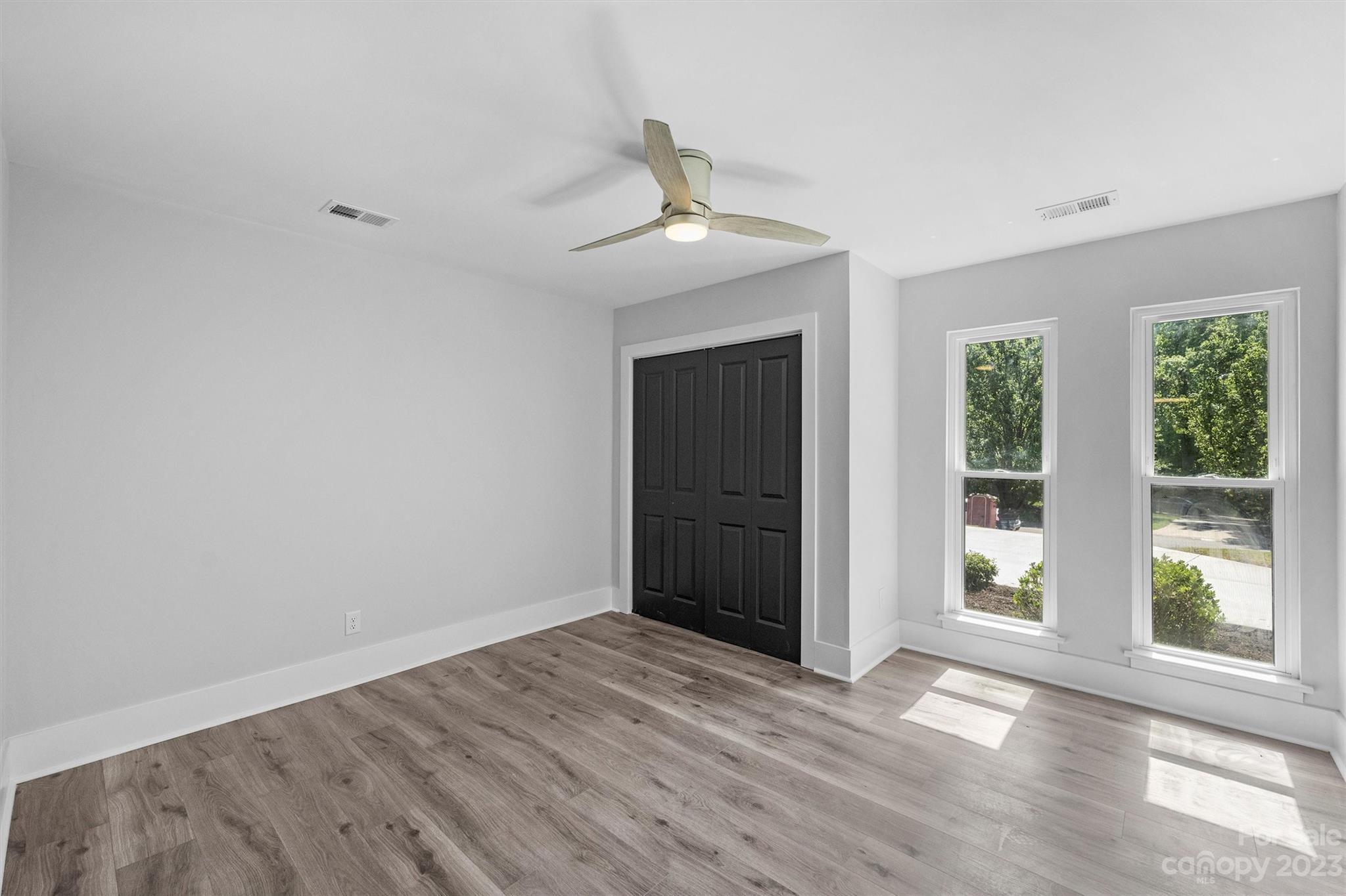 4600 Rounding Run Road Charlotte, NC 28277 - Photo 25 of 33 a view of an empty room with wooden floor and a window