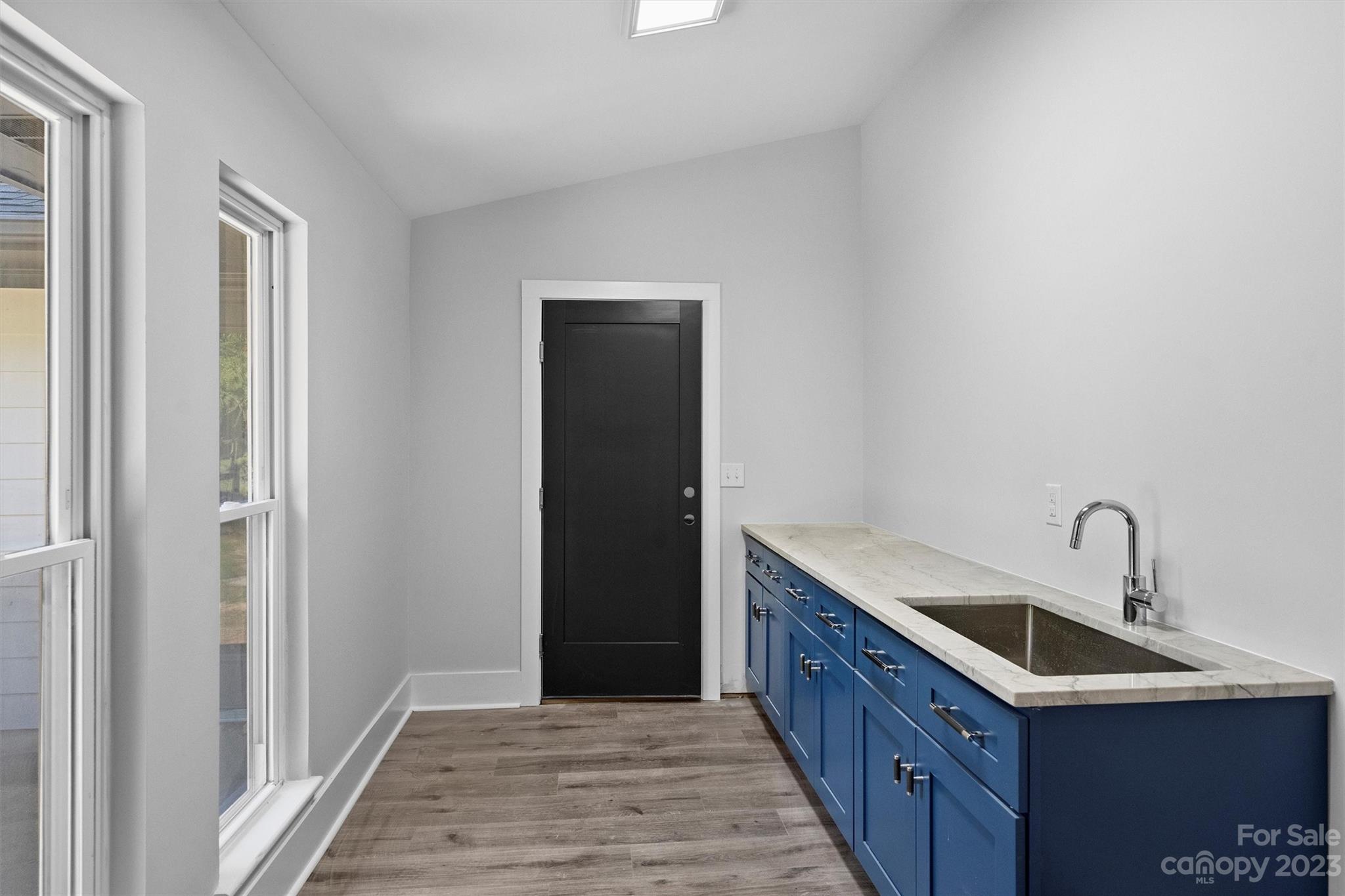 4600 Rounding Run Road Charlotte, NC 28277 - Photo 27 of 33 a kitchen with a sink and cabinets