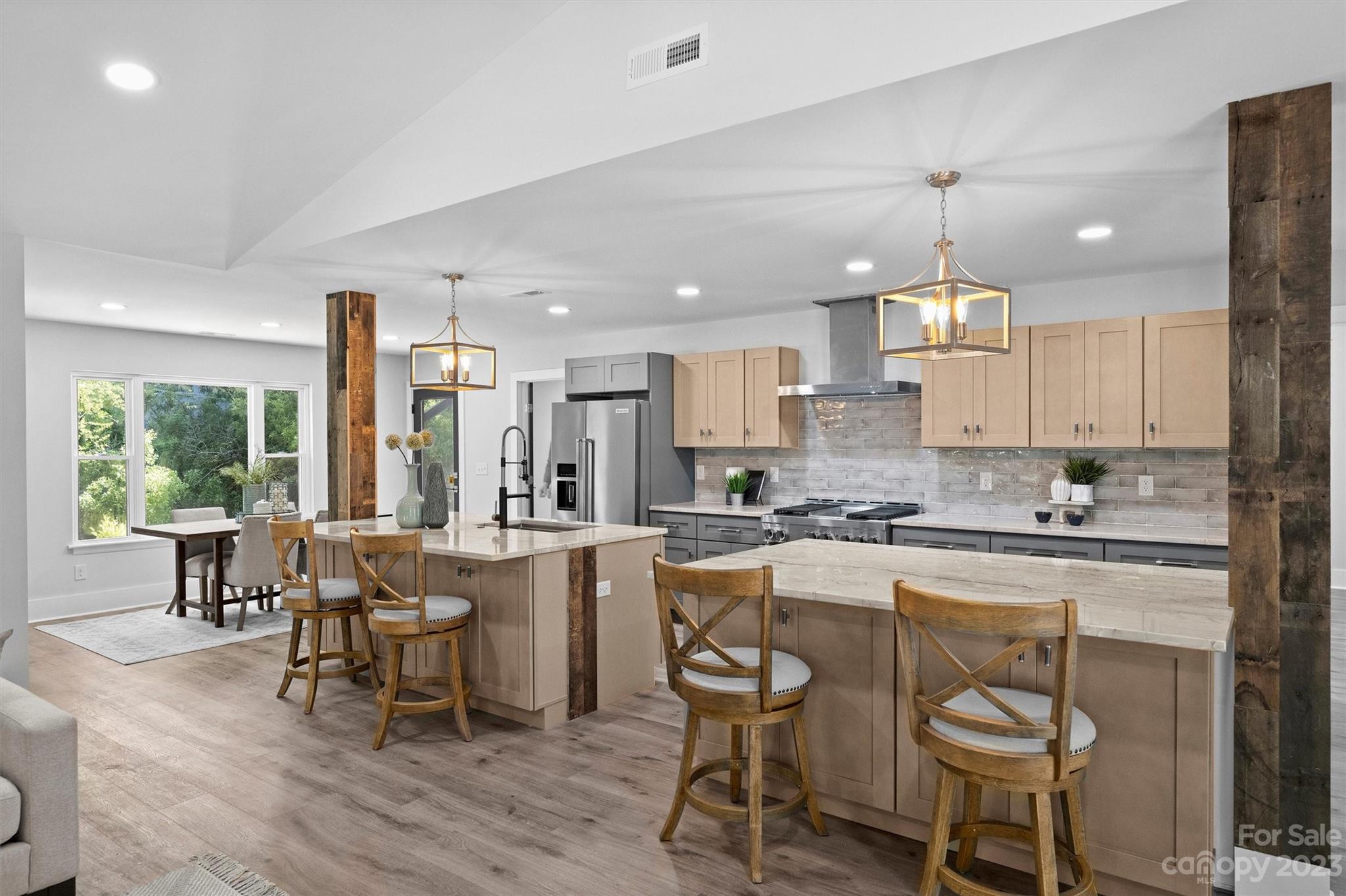 4600 Rounding Run Road Charlotte, NC 28277 - Photo 4 of 33 a large kitchen with a table and chairs in it