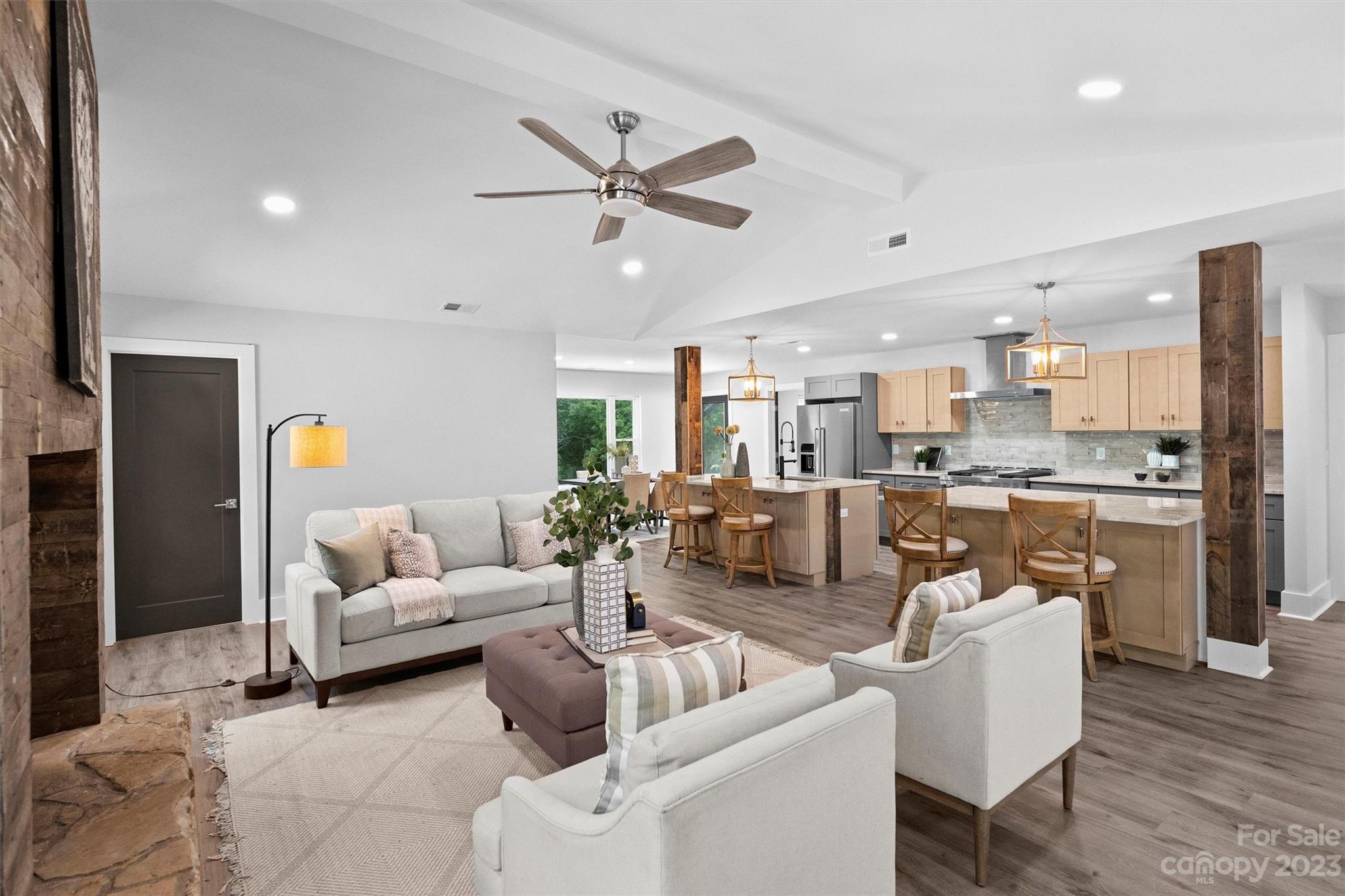 4600 Rounding Run Road Charlotte, NC 28277 - Photo 7 of 33 a living room with furniture kitchen view and a chandelier