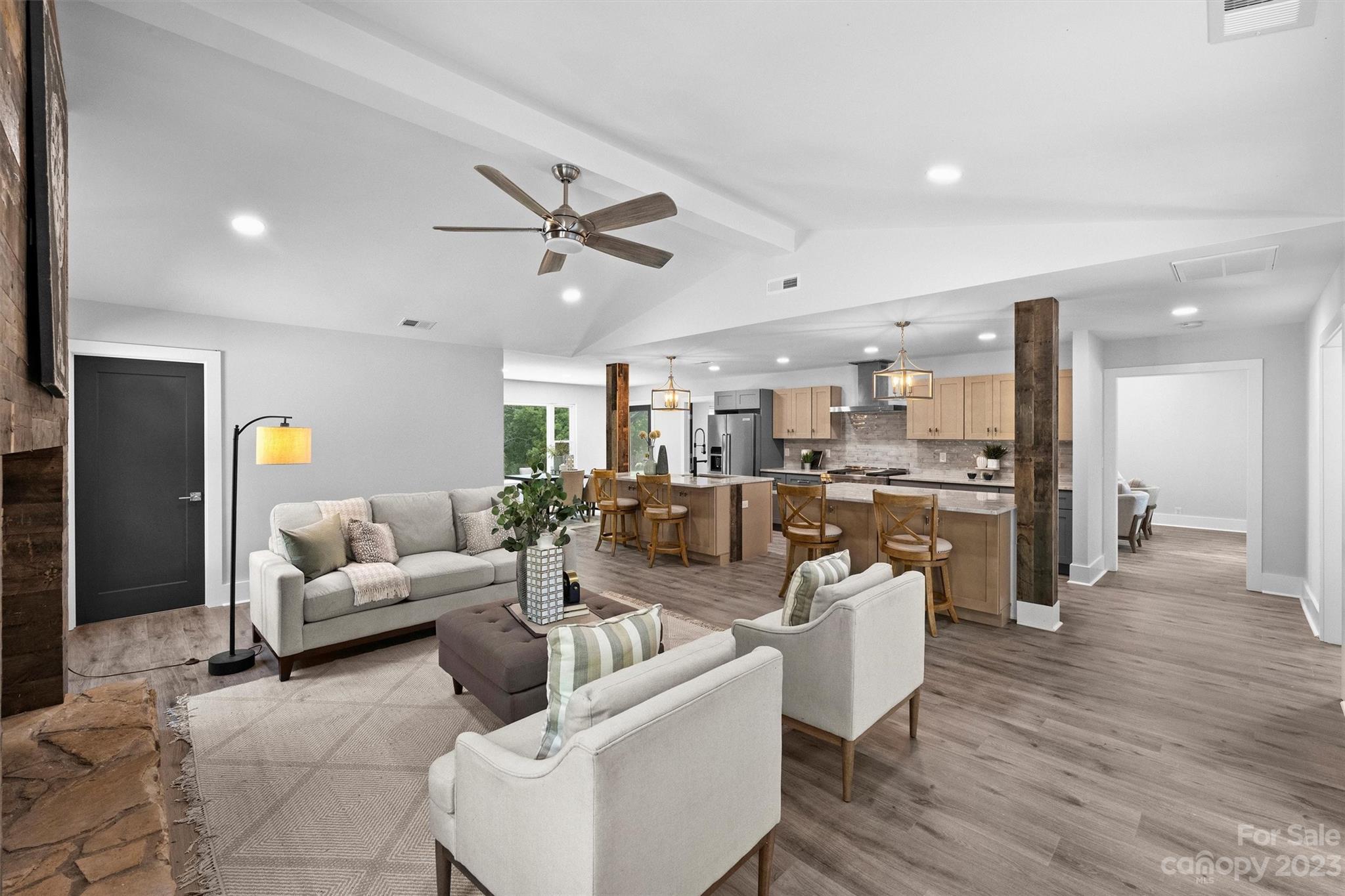 4600 Rounding Run Road Charlotte, NC 28277 - Photo 10 of 33 a living room with furniture kitchen view and a wooden floor
