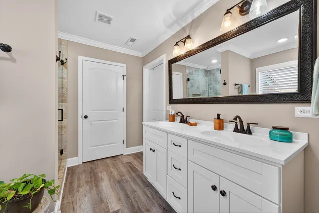 a hallway with mirror and window