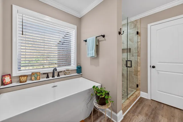 a bath room with a bathtub and a window