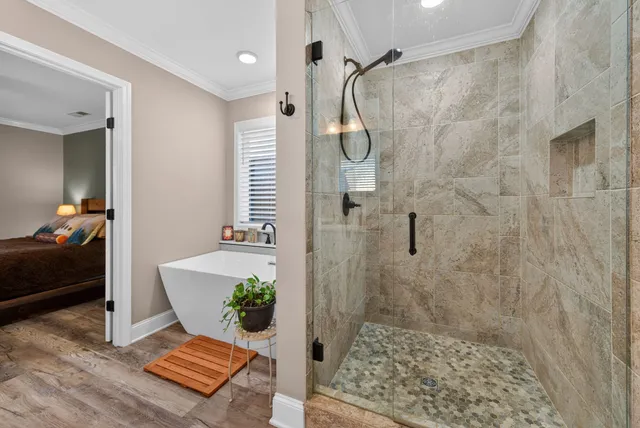 a bathroom with a shower a toilet and a sink