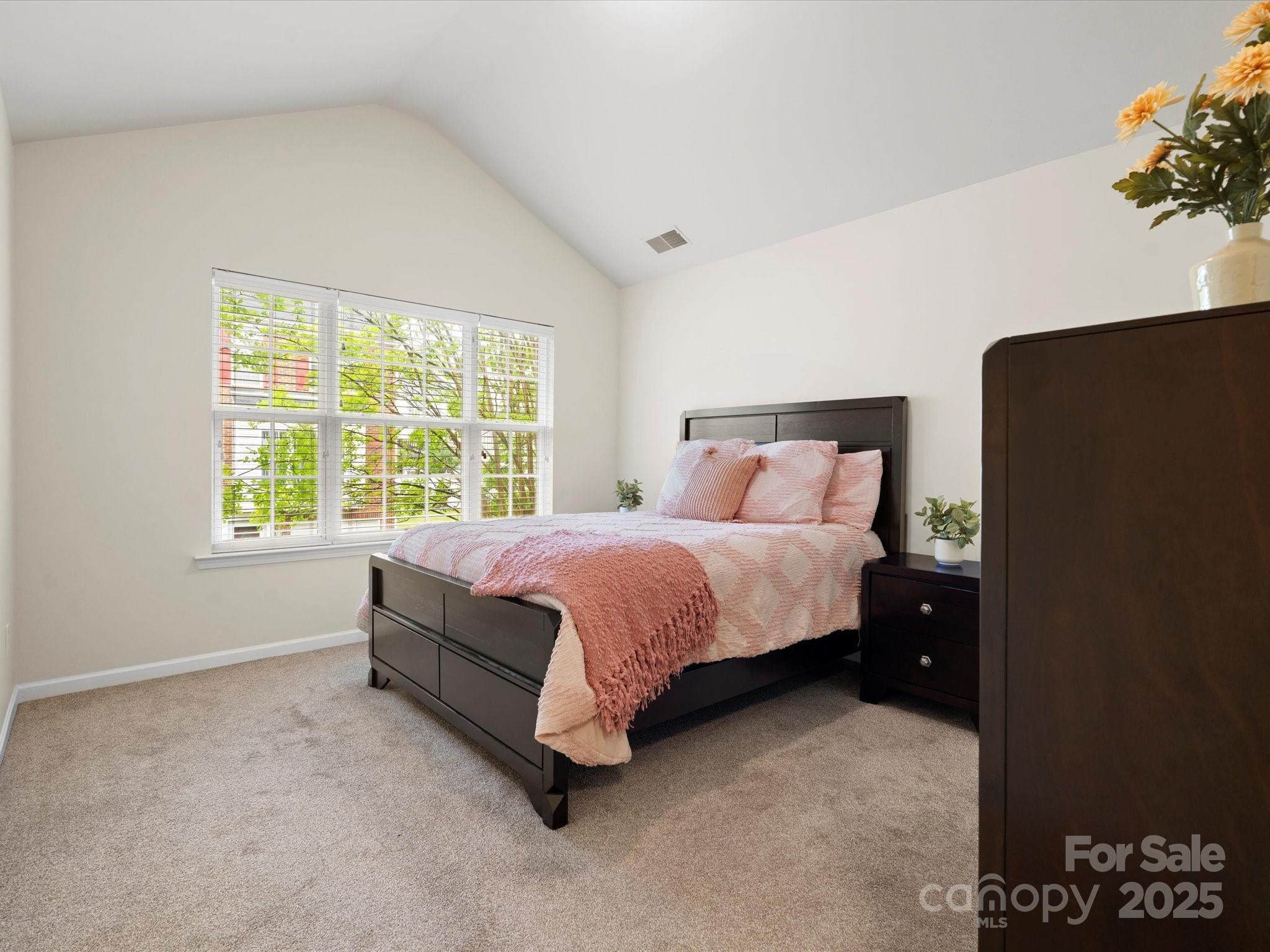 2137 Midnight Blue Lane Fort Mill, SC 29708 - Photo 17 of 40 a bed sitting in a bedroom next to a window