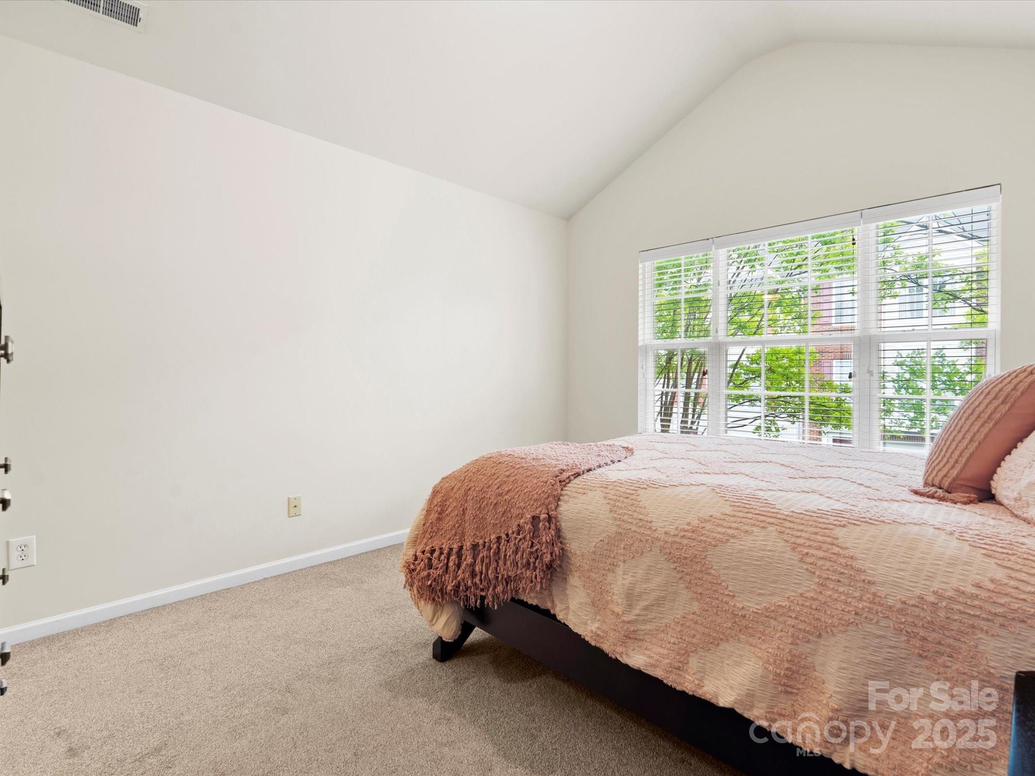 2137 Midnight Blue Lane Fort Mill, SC 29708 - Photo 18 of 40 a bed sitting in a bedroom next to a window