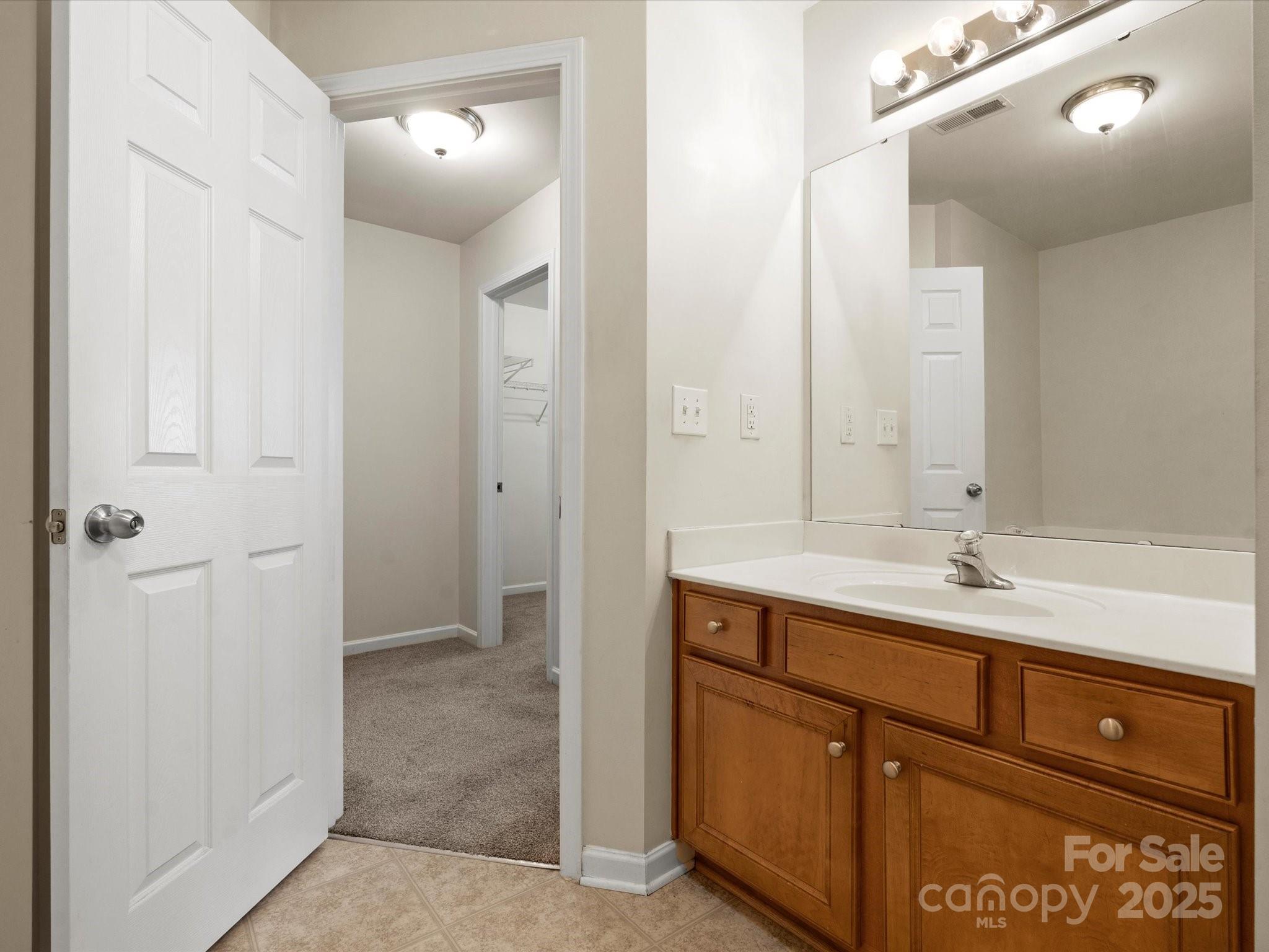 2137 Midnight Blue Lane Fort Mill, SC 29708 - Photo 20 of 40 a bathroom with a sink and a mirror