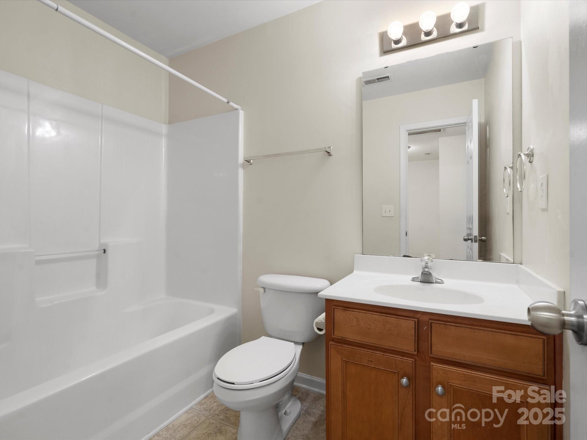 2137 Midnight Blue Lane Fort Mill, SC 29708 - Photo 24 of 40 a bathroom with a sink a toilet and a bathtub