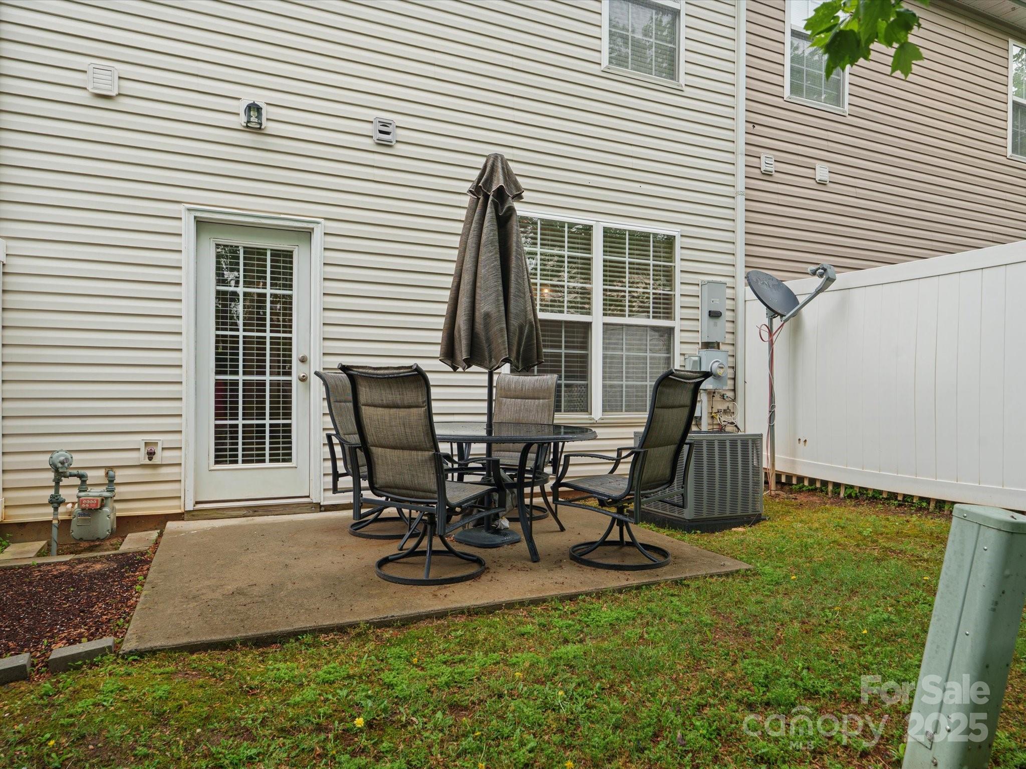 2137 Midnight Blue Lane Fort Mill, SC 29708 - Photo 28 of 40 a view of a dinning table and chairs in the patio