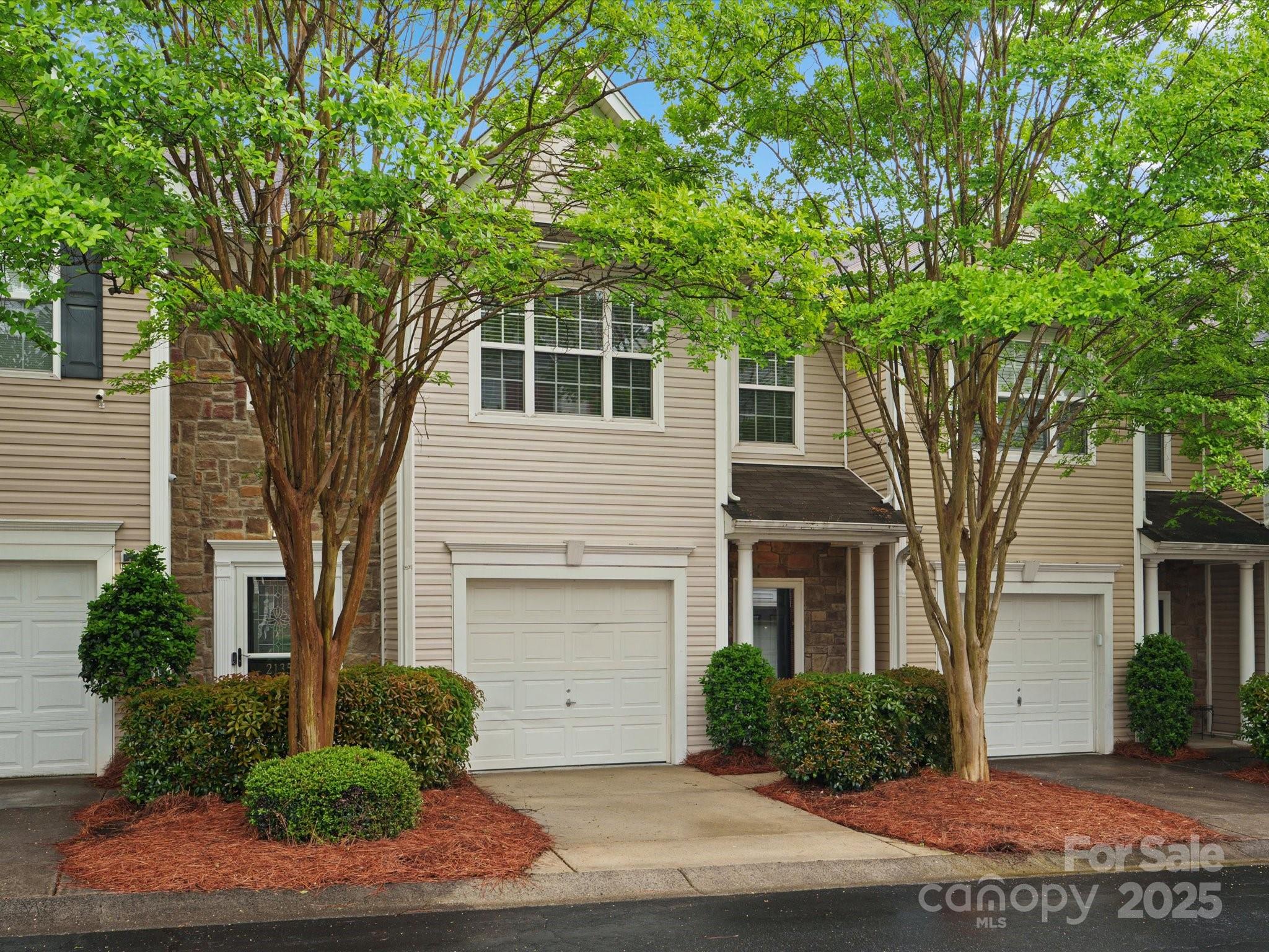 2137 Midnight Blue Lane Fort Mill, SC 29708 - Photo 32 of 40 a front view of a house with garden