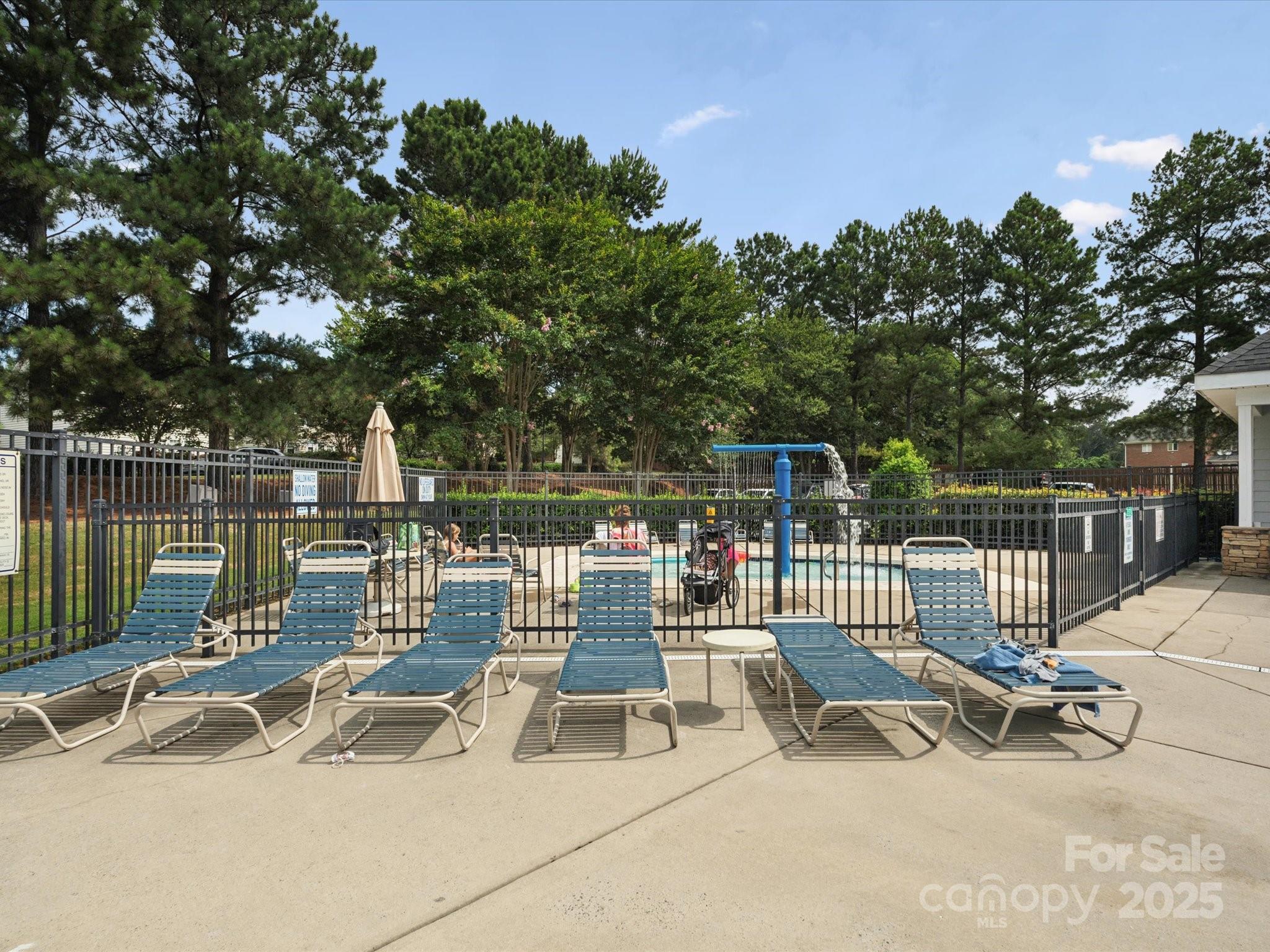 2137 Midnight Blue Lane Fort Mill, SC 29708 - Photo 35 of 40 a view of a patio with a bench and trees