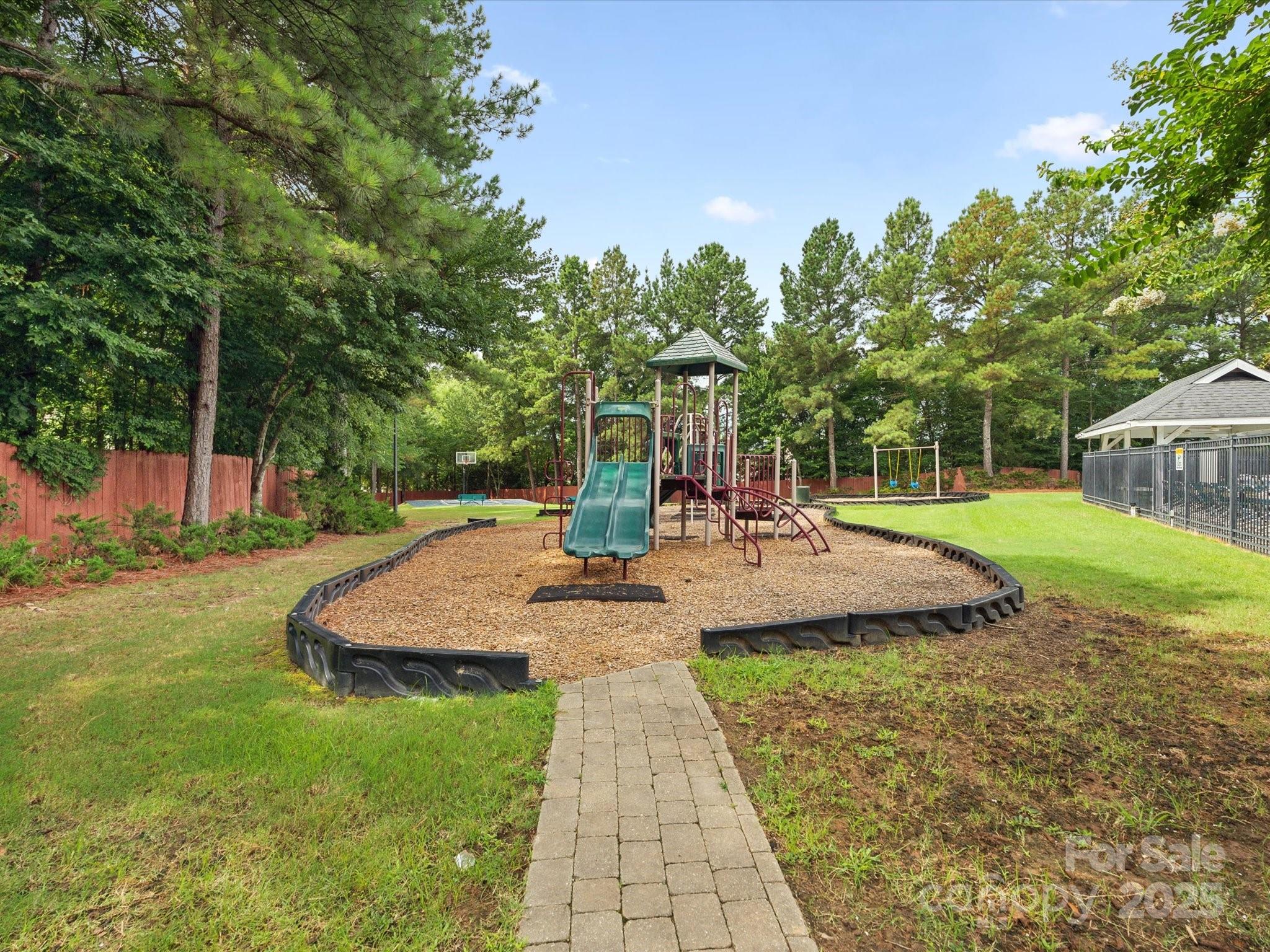 2137 Midnight Blue Lane Fort Mill, SC 29708 - Photo 38 of 40 a view of a house with backyard and sitting area
