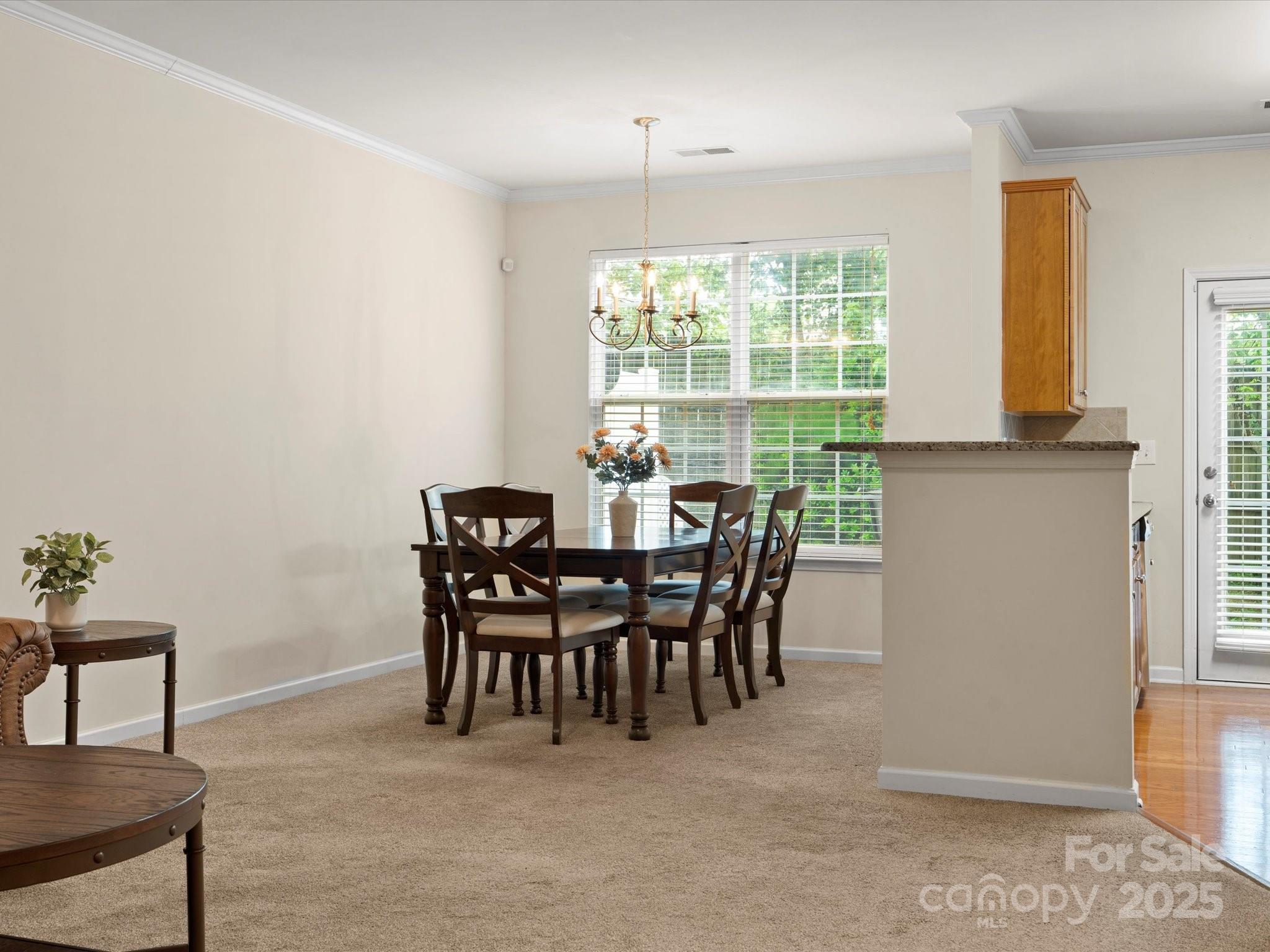 2137 Midnight Blue Lane Fort Mill, SC 29708 - Photo 5 of 40 a view of a dining room with furniture and a window