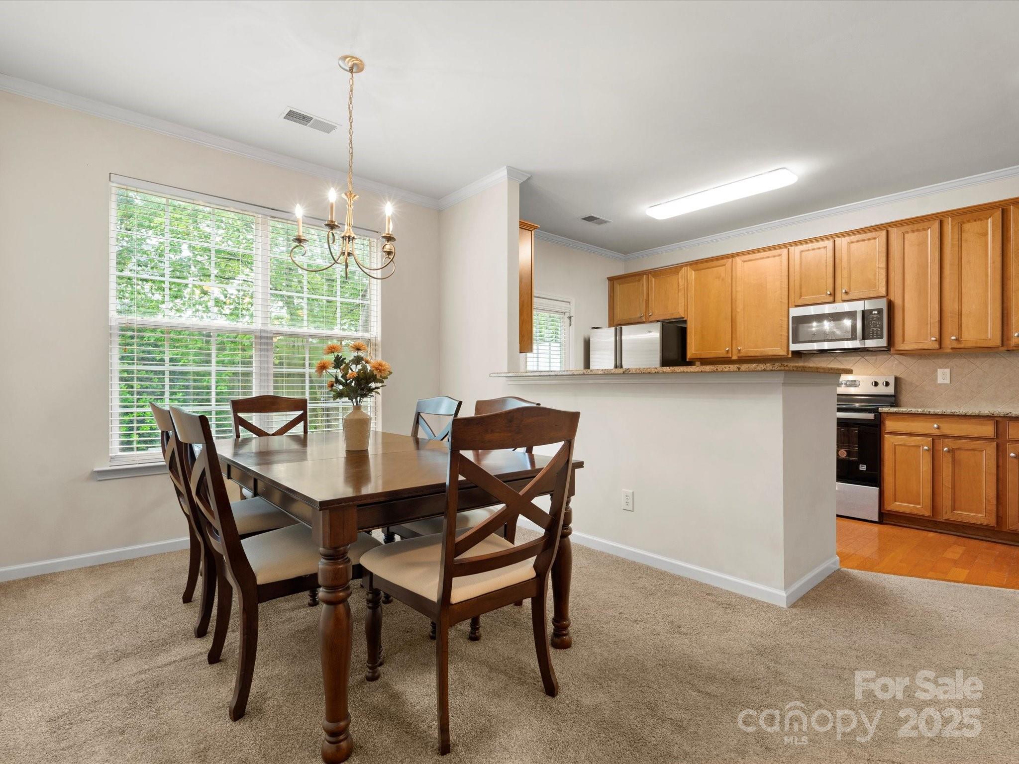 2137 Midnight Blue Lane Fort Mill, SC 29708 - Photo 6 of 40 a view of a dining room with furniture window and outside view