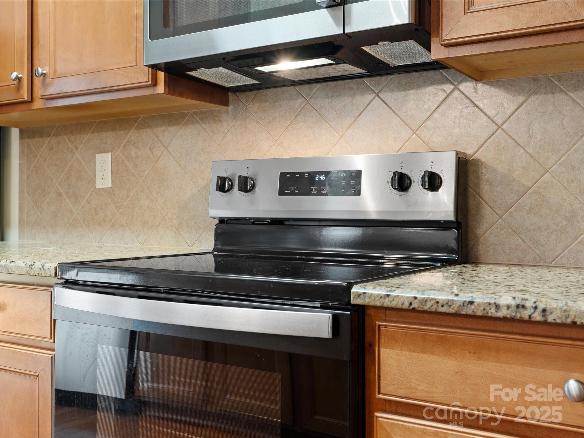 2137 Midnight Blue Lane Fort Mill, SC 29708 - Photo 10 of 40 a stove top oven sitting inside of a kitchen