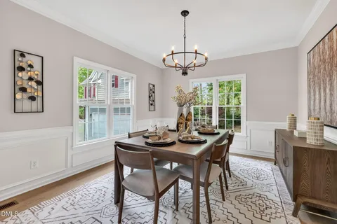 a view of a dining room with furniture window and wooden floor