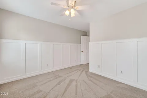 a view of backyard with table and chairs under an umbrella