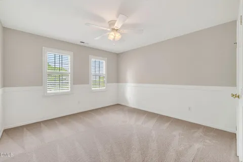 front view of a house with a garden