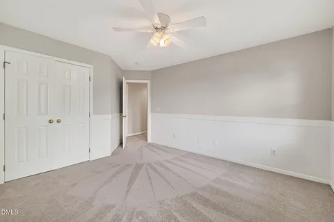 an aerial view of a house with garden space and a street view