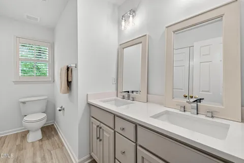 an aerial view of a house with garden space and street view