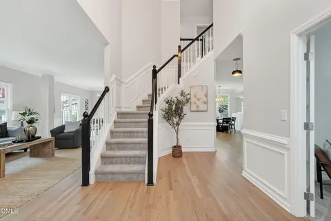 a view of entryway and hall with wooden floor