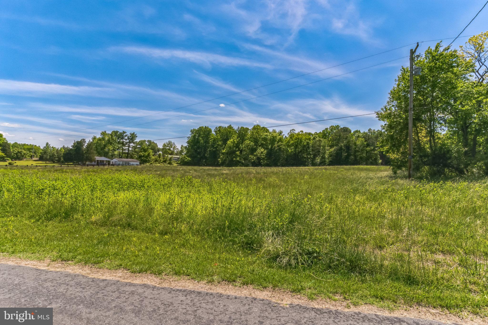 2195 Henry Hutchins Road Prince Frederick, MD 20678 - Photo 8 of 25 a view of a lake with a yard