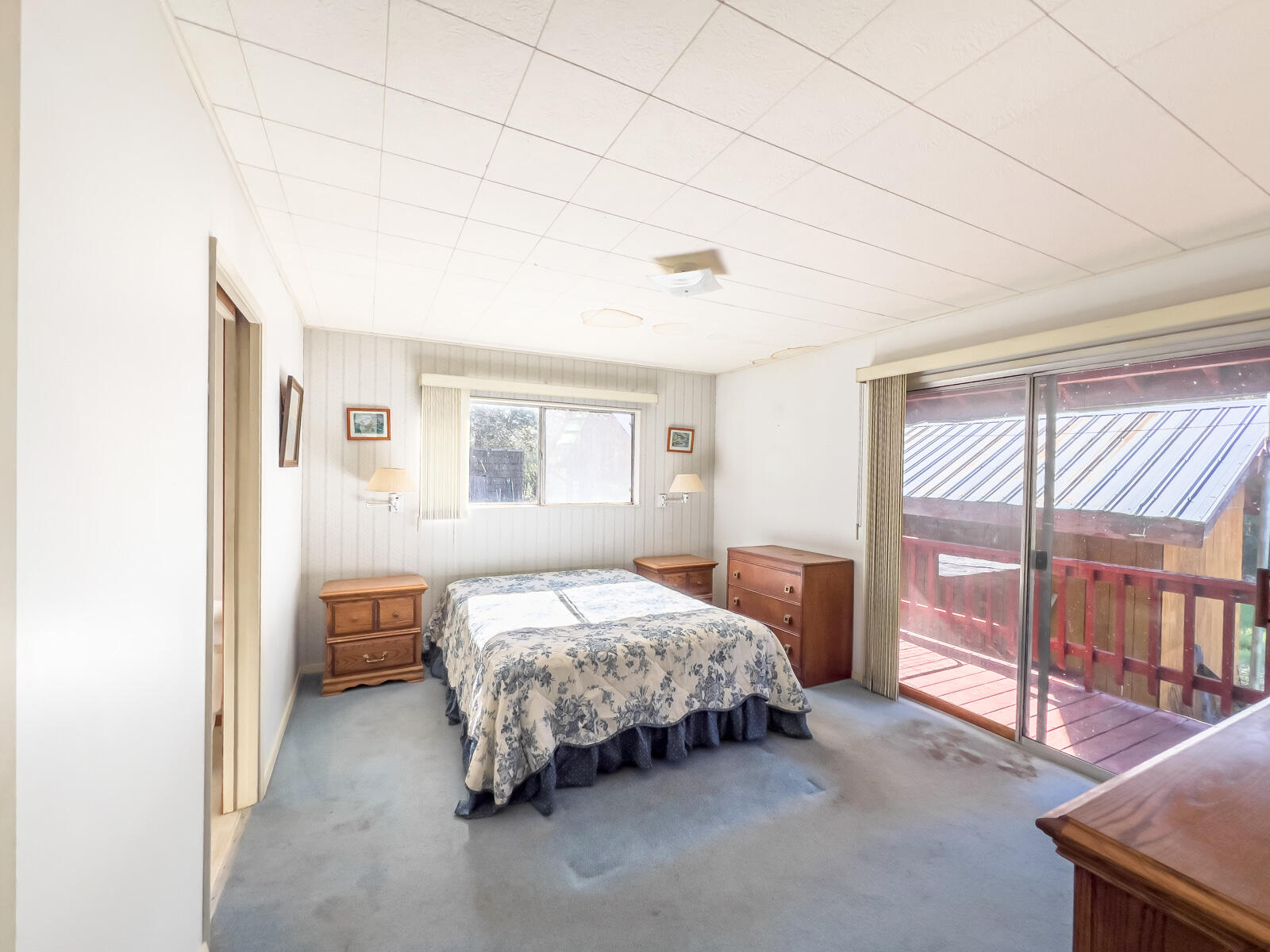 1040 Mullane Trail Big Bar, CA 96010 - Photo 18 of 49 a bedroom with a bed and a large window