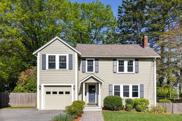 a front view of a house with yard