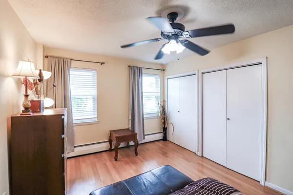 a view of a livingroom with a window and wooden floor