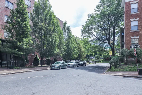 a view of street with parked cars