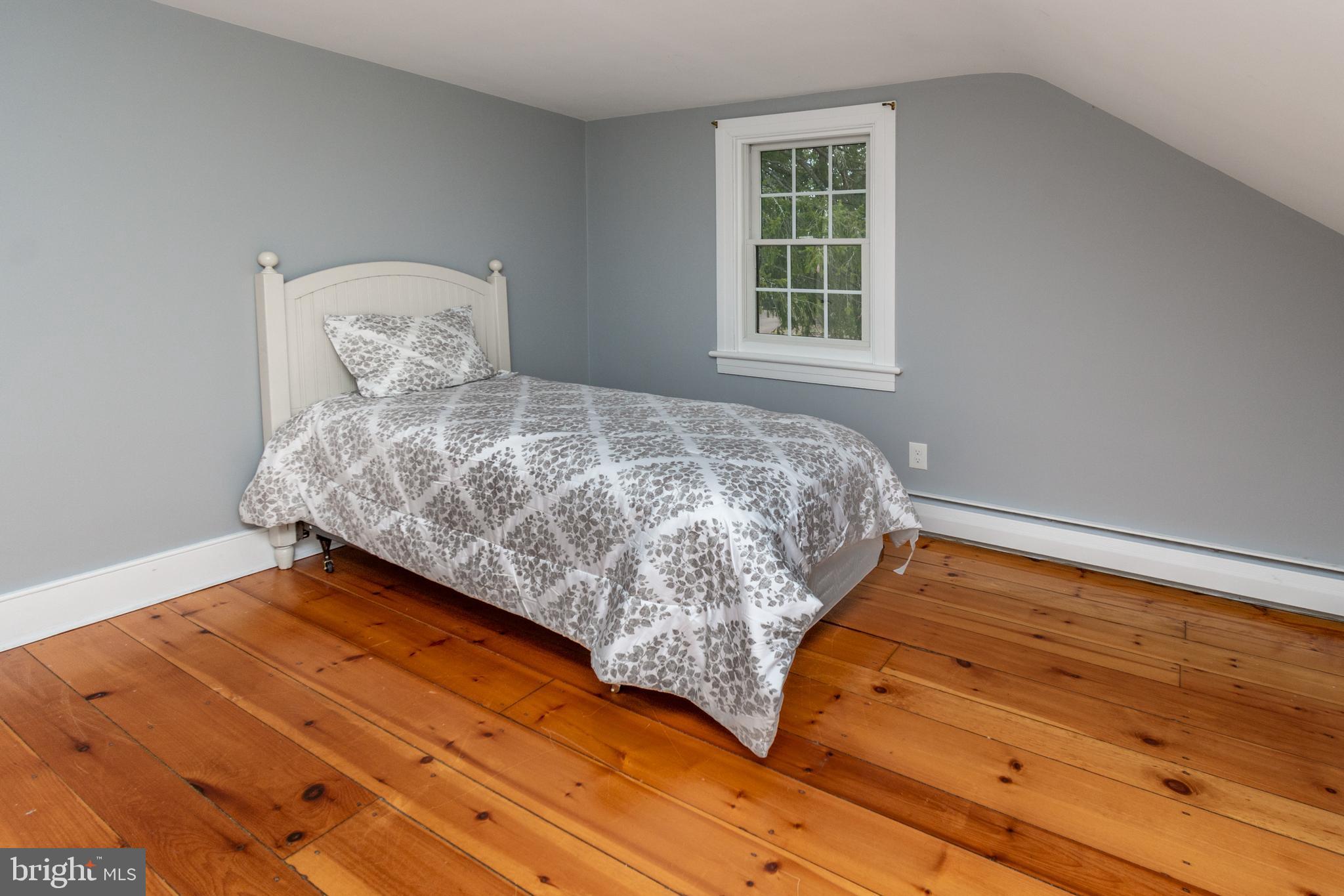 180 Municipal Road Pipersville, PA 18947 - Photo 53 of 60 a bedroom with a bed and wooden floor