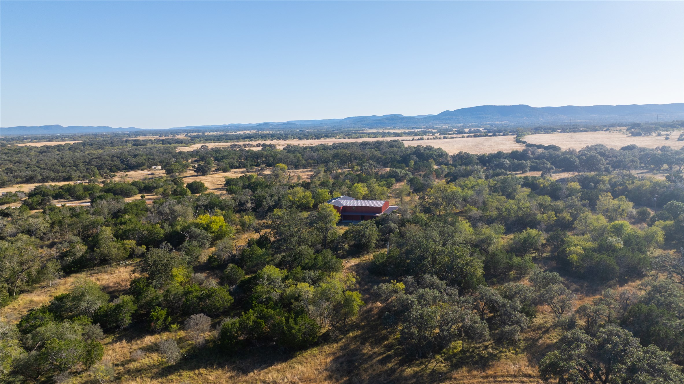 358 Cornelius Road Utopia, TX 78884 - Photo 3 of 33 an aerial view of mountain with trees in the background
