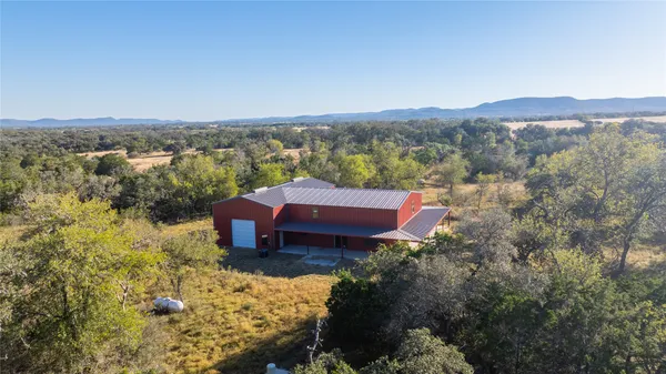 an aerial view of a house with a garden