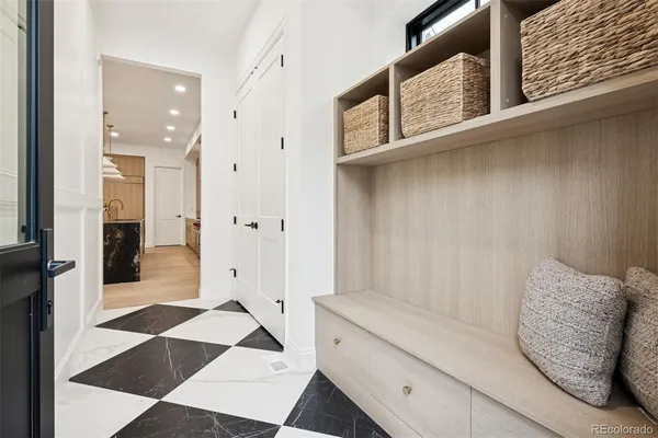 a view of a hallway with windows and stairs