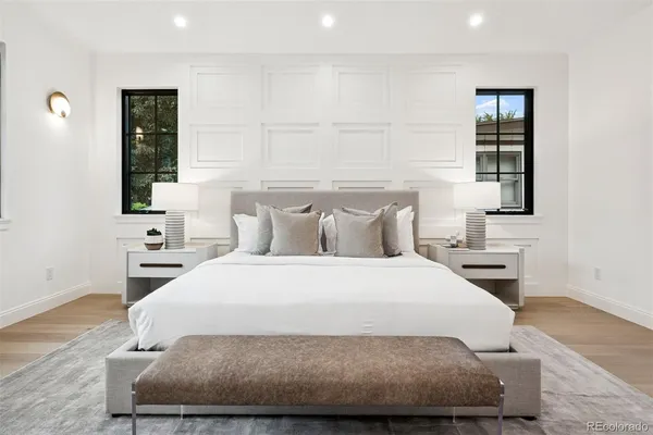 a spacious bedroom with a bed and a couch