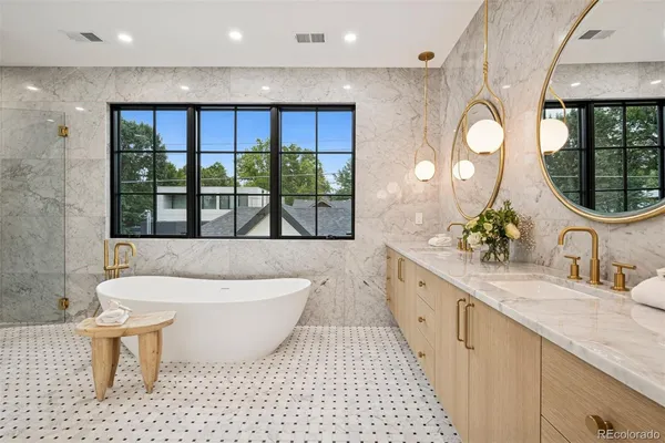 a bathroom with a granite countertop sink mirror and vanity
