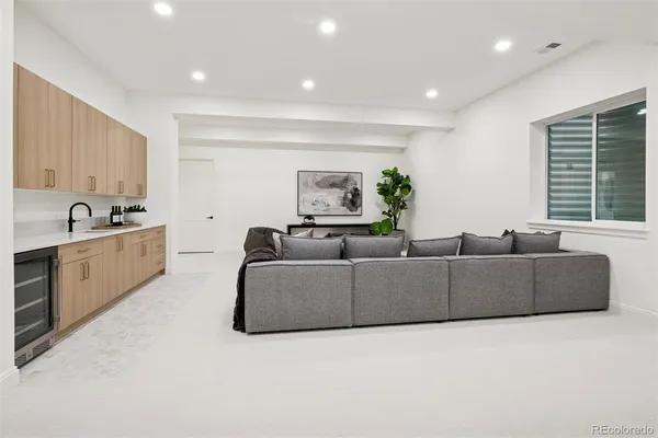 a view of living room with furniture and window