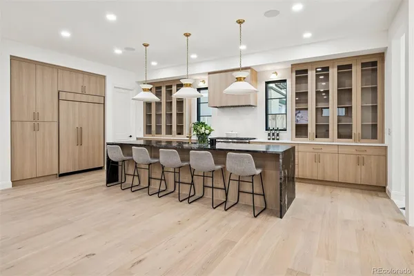 a open kitchen with a table and chairs in it