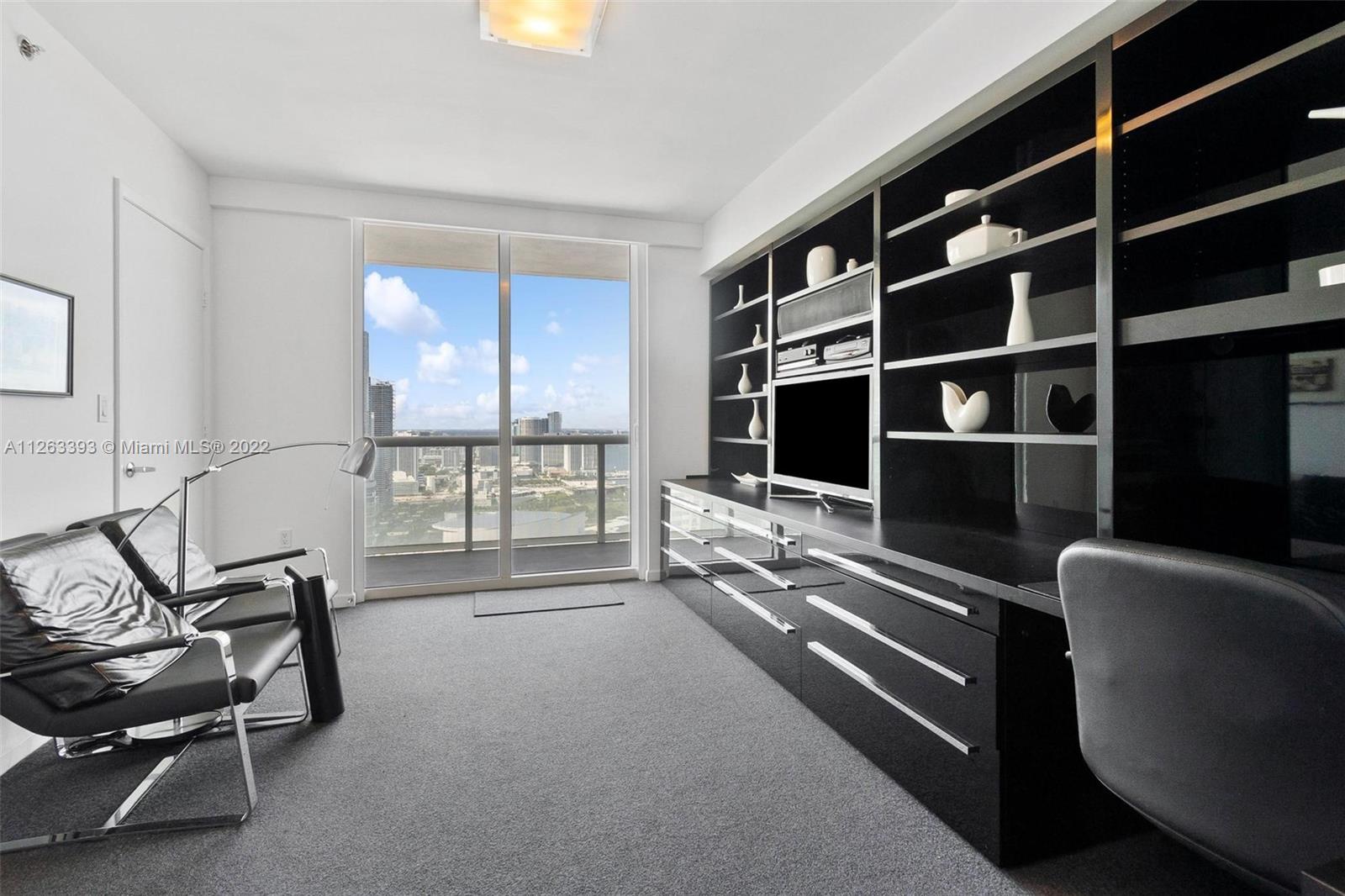 50 Biscayne Boulevard, Unit 4802 Miami, FL 33132 - Photo 12 of 33 a living room with furniture