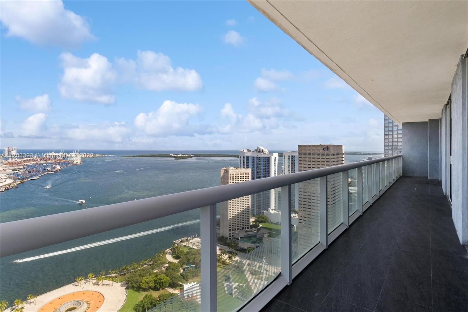 50 Biscayne Boulevard, Unit 4802 Miami, FL 33132 - Photo 27 of 33 a view of a balcony with wooden floor and lake view