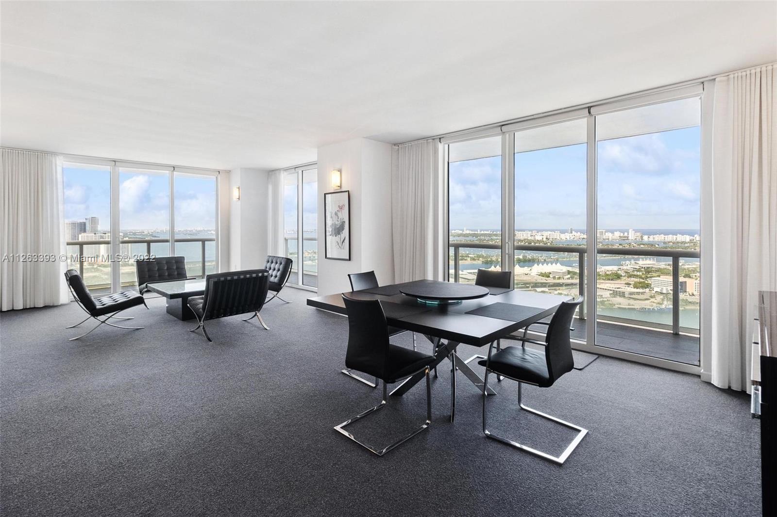 50 Biscayne Boulevard, Unit 4802 Miami, FL 33132 - Photo 7 of 33 a view of a livingroom with furniture and a window