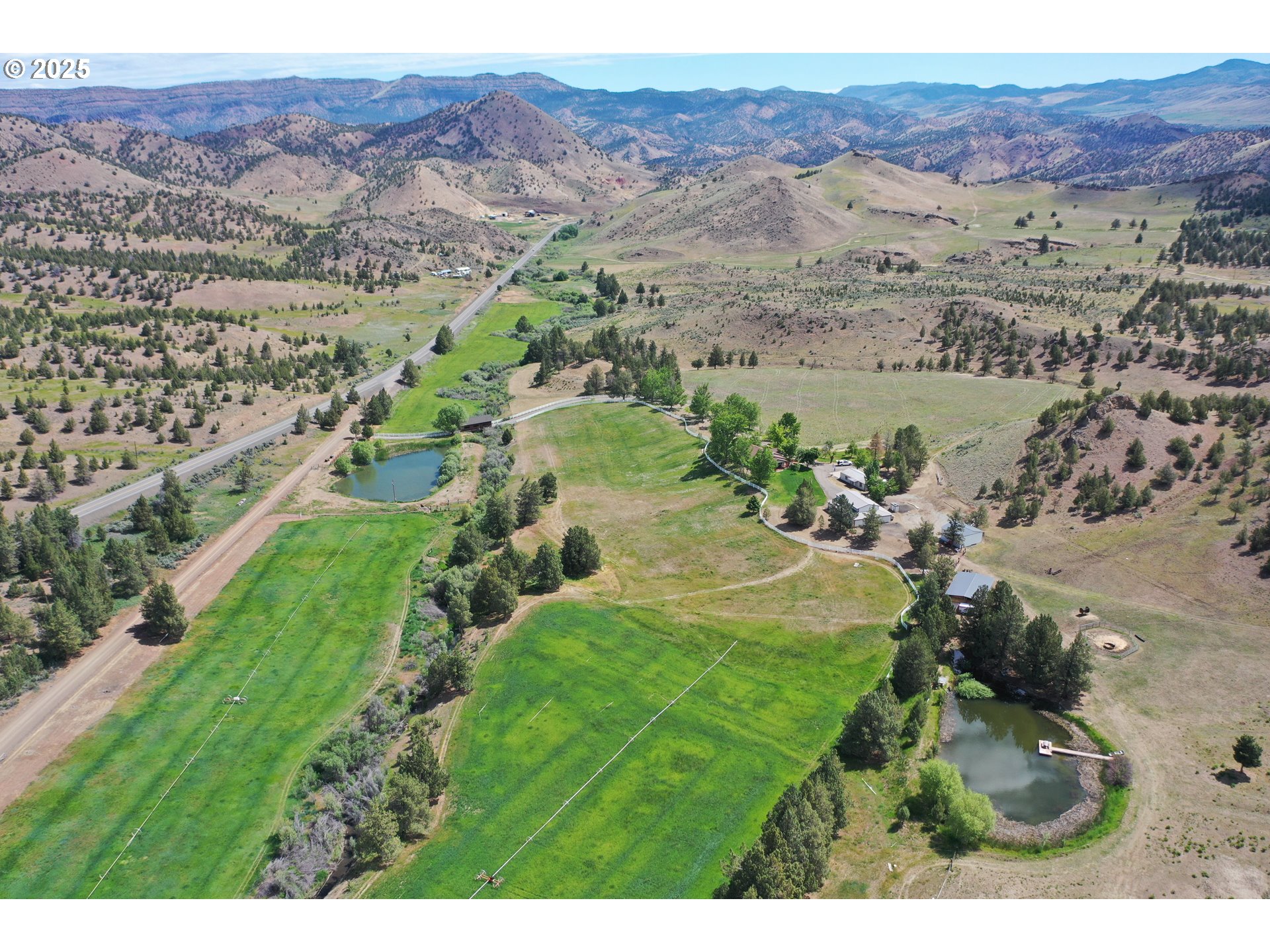 33817 Gage Road Mitchell, OR 97750 - Photo 1 of 48 a view of a city with mountains in the background