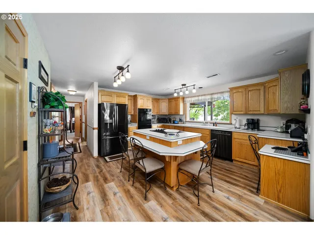 a kitchen with a table and chairs in it