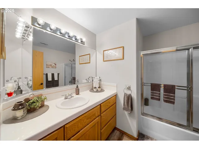 a bathroom with a sink vanity and a mirror