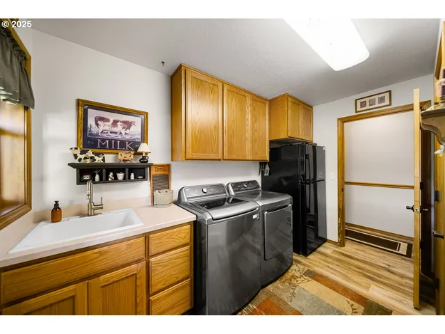 a kitchen with a refrigerator and a sink