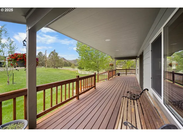 a view of balcony with wooden floor