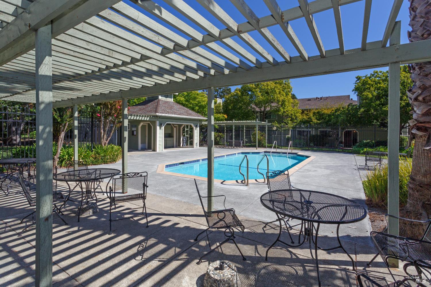 130 Agua Caliente Road West Sonoma, CA 95476 - Photo 16 of 17 a patio with glass top table and chairs
