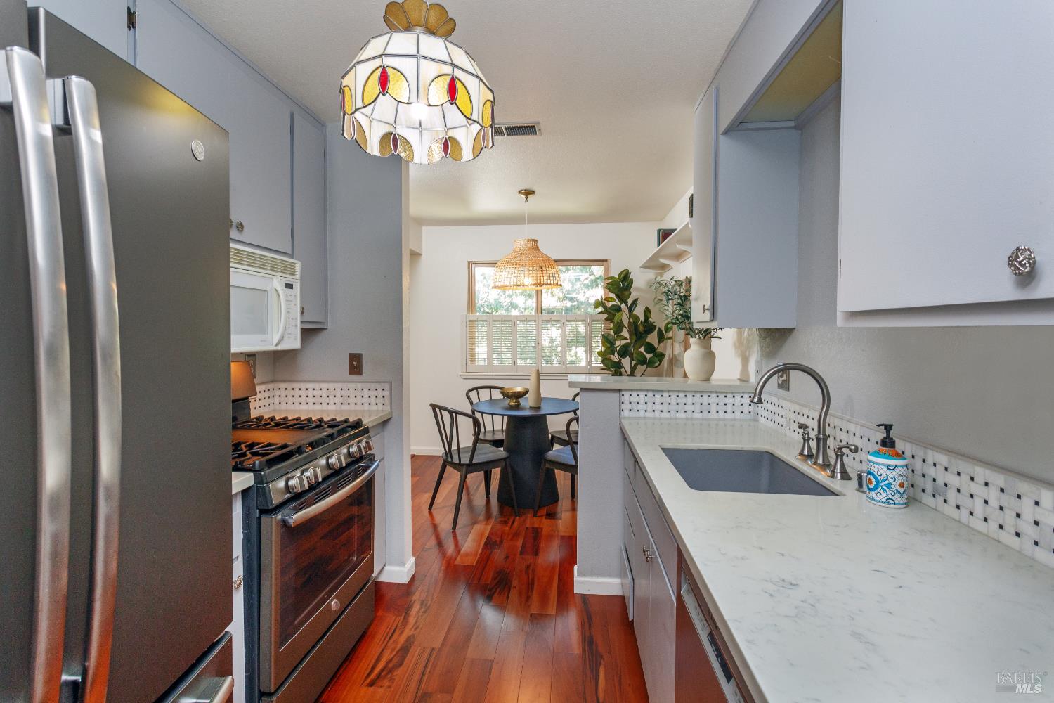 130 Agua Caliente Road West Sonoma, CA 95476 - Photo 5 of 17 a kitchen with stainless steel appliances granite countertop a stove top oven a sink and dishwasher