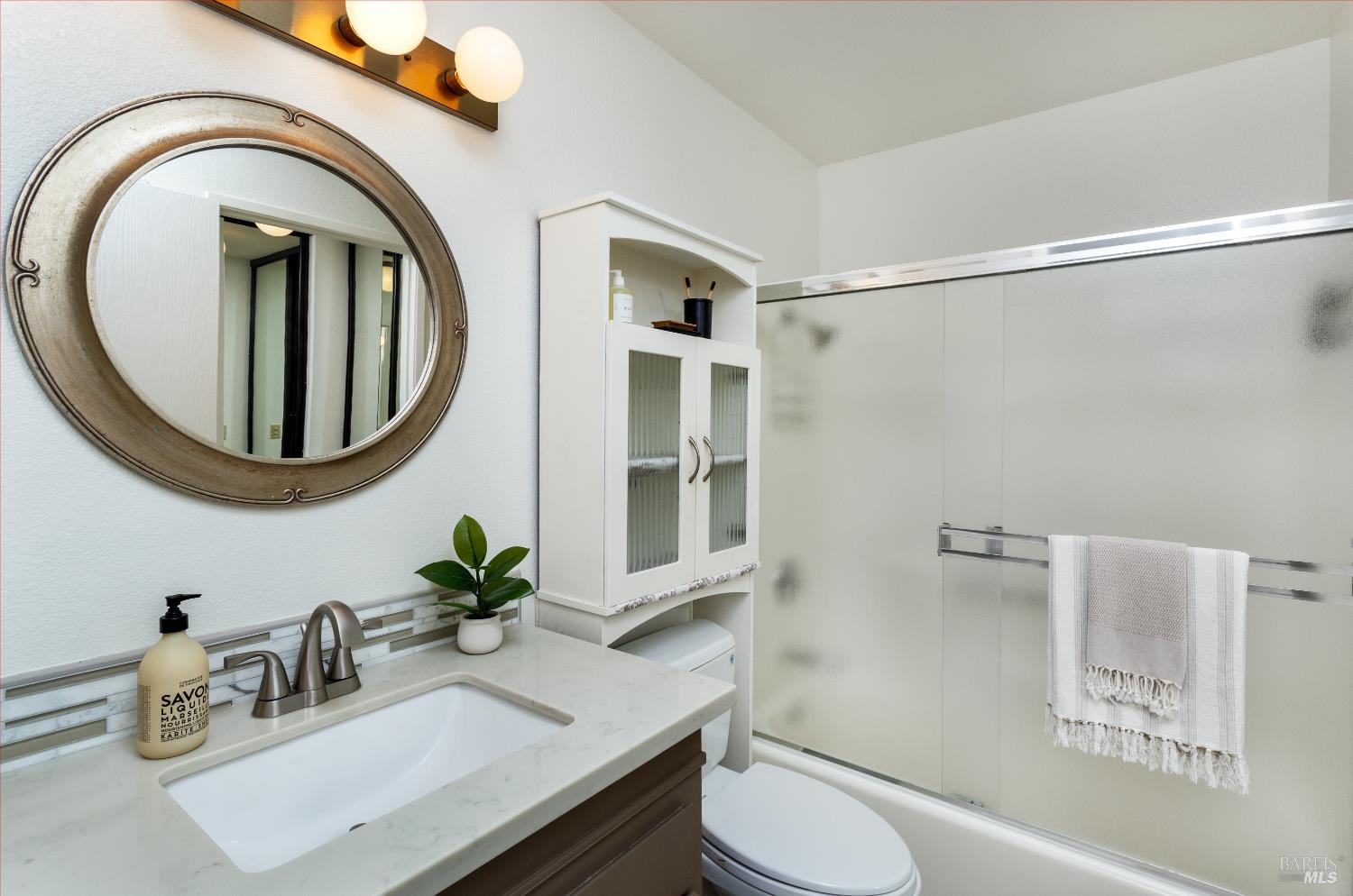 130 Agua Caliente Road West Sonoma, CA 95476 - Photo 8 of 17 a bathroom with a toilet a sink and a mirror