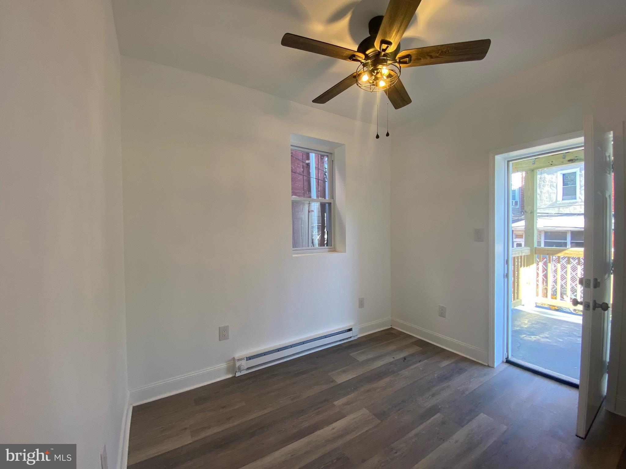 4019 Old York Road, Unit 1 Philadelphia, PA 19140 - Photo 4 of 5 wooden floor in an empty room with a window